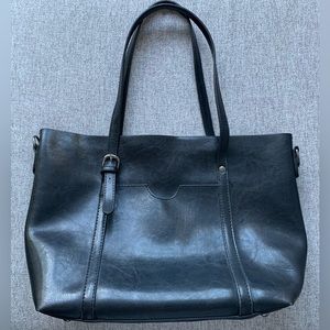 Black handbag with multiple interior pockets.